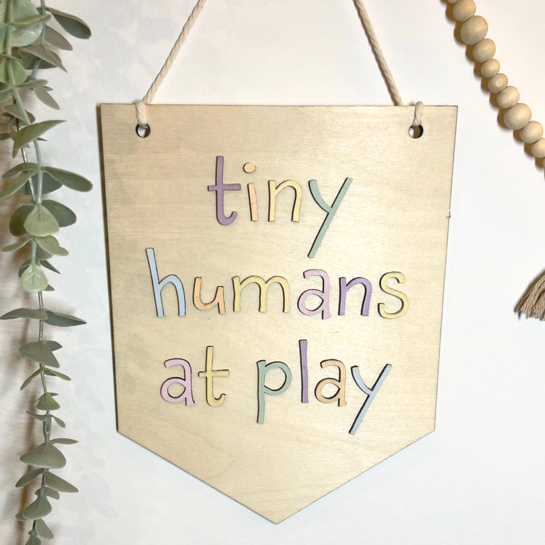 Tiny humans at play | Wall hanging